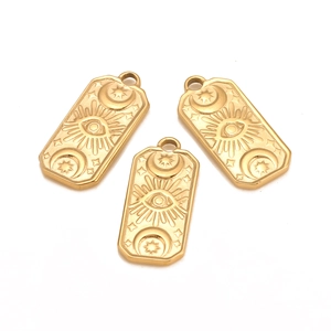 Detail of gold rectangular pendants featuring sun, crescent moon and star relief engravings