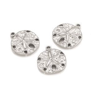 Detail of three stainless steel sand dollar pendants with textured relief for DIY jewelry