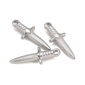 Detail shot of three silver sword pendants with textured blades for DIY jewelry making
