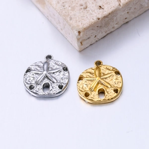 Set of gold and silver stainless steel starfish charms with intricate textured details