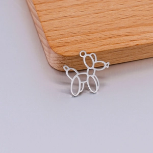 Detail of mirror polished hollow balloon dog charm for DIY necklace and bracelet crafting