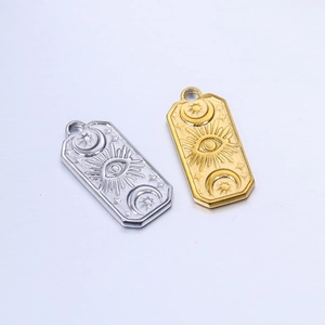Detail of rectangular celestial pendants with sun eye and moon star relief patterns