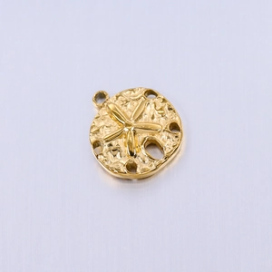 Detailed close-up of golden starfish textured circular pendant with a round bail charm