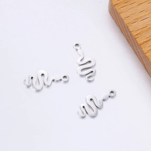 Polished stainless steel snake charms for DIY jewelry making on white background