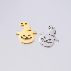 Detailed view of hollow pumpkin charms with wizard hats in gold and silver finish