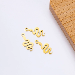 Polished gold stainless steel snake charms for DIY jewelry making on white background