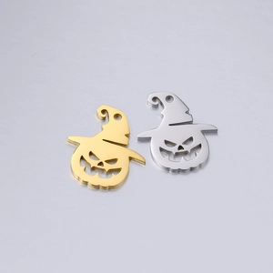 Macro detail of pumpkin lantern charms in gold and silver finish for DIY jewelry