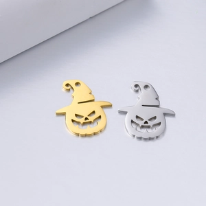 Detail of Halloween pumpkin charms with wizard hats in polished gold and silver finish