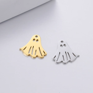 Macro view of mirror polished stainless steel ghost charms in gold and silver finishes