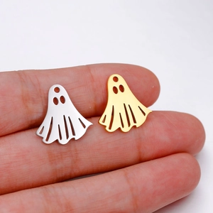 Detailed view of silver and gold ghost pendants for Halloween jewelry making