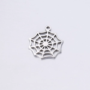Macro view of polished stainless steel spider web pendant with hollowed design and top loop