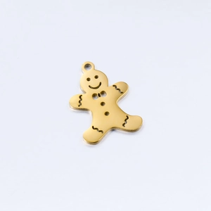 Detailed view of a polished gold gingerbread man pendant for DIY jewelry making