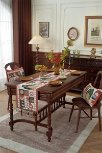 Detailed embroidery of moons and stars on a polyester table runner with elegant tassels