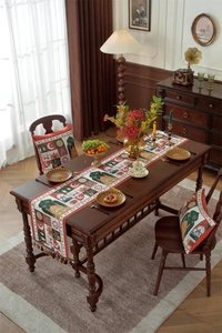 Close-up of jacquard table runner featuring moon, stars, and tassels for festive decor