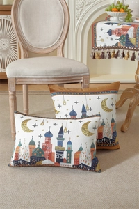 Detail of woven Ramadan pillow cover with mosque patterns and decorative table runner fringe