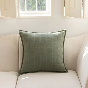 Detail of grey-green plaid texture and double-sided jacquard on decorative cushion cover
