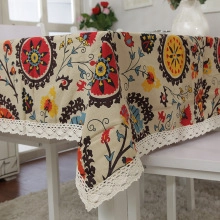 Close-up of bohemian mandala cotton linen tablecloth with elegant white lace border