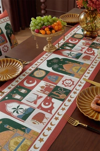 Detail of Eid al-Fitr table runner featuring mosque and crescent patterns on wood