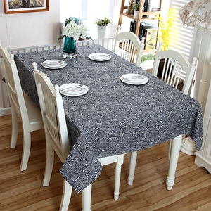 Close-up of rectangle tablecloth with blue and white wave pattern and lace edges
