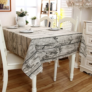 Detail of faux wood grain printed tablecloth featuring a rustic tree bark pattern