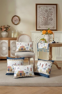 Detail of blue and white Islamic style cushion covers and fringed table runner set