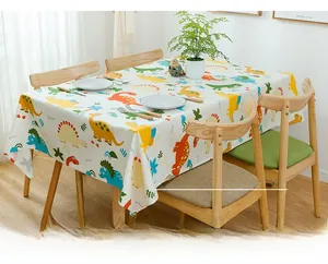 Detail of cartoon dinosaur print cotton tablecloth showing reactive printing quality