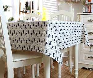 Detailed view of ocean whale printed linen tablecloth with elegant lace edges