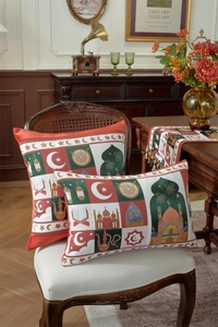 Close-up of jacquard table runner and pillows with Islamic moon and star patterns
