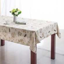 Detailed close-up of retro map printed cotton linen tablecloth with elegant lace edge