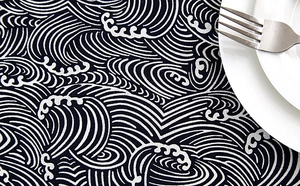 Close-up of Japanese wave pattern tablecloth with cotton-linen texture and table setting