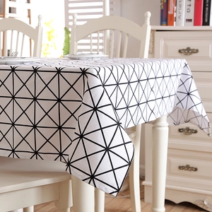 Detailed texture of thick cotton canvas tablecloth with black geometric triangle patterns