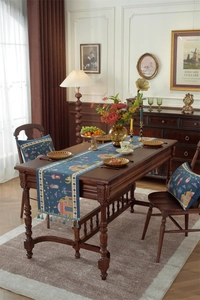 Detail of woven table runner and cushions with Middle Eastern star and moon pattern