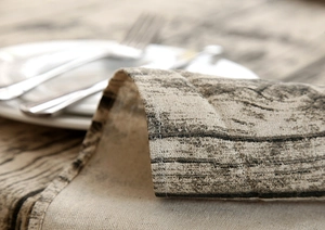 Close-up of wood grain printed linen fabric showing high-quality stitching and texture