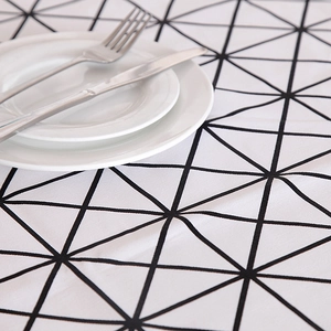 Detail of minimalist black and white geometric triangle pattern on thick cotton canvas tablecloth