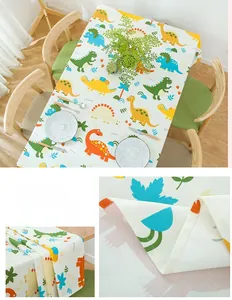 Detailed close-up of thick cotton fabric texture and colorful cartoon dinosaur print