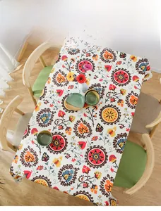 Close-up of bohemian thick cotton tablecloth featuring colorful sunflower mandala prints