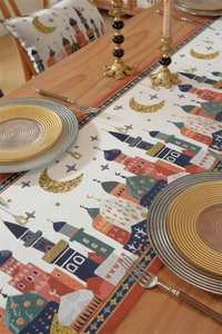 Detailed macro view of woven jacquard fabric with castle and moon patterns for table runner