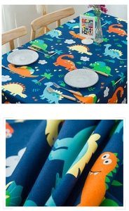 Detailed view of thick cotton dinosaur print tablecloth with vibrant cartoon patterns