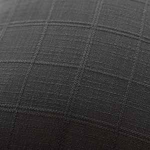 Macro shot of dark grey jacquard woven fabric showing detailed 3D plaid texture
