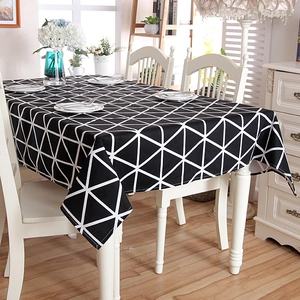 Detail of modern cotton canvas tablecloth with black and white geometric triangle patterns