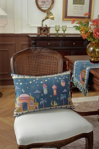Detail of blue Eid Mubarak table runner and pillowcase with mosque embroidery and tassels