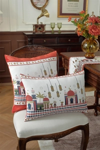 Close-up of moon and star mosque pattern on fabric cushion covers and table runner