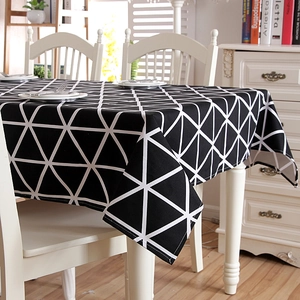Detailed texture of thick cotton canvas tablecloth with black and white geometric triangles