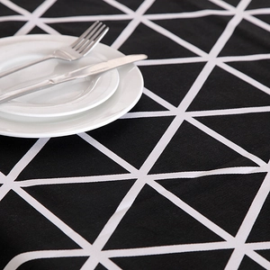 Close-up of black and white geometric triangle pattern on thick cotton canvas tablecloth