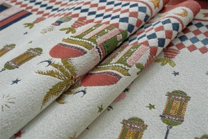 Detailed macro view of festive table runner with golden moon stars and jacquard weave