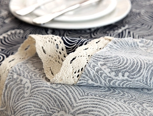Detailed close-up of Japanese wave pattern tablecloth with decorative cotton lace trim
