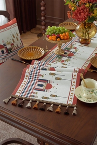 Detailed close-up of Middle Eastern jacquard table runner with moon pattern and colorful tassels