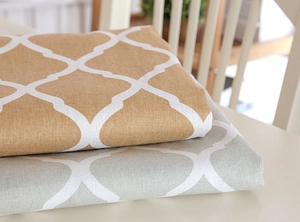 Detail of yellow and grey quatrefoil tablecloth showing high-quality cotton linen texture