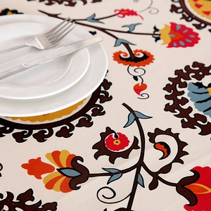 Ethnic thick cotton canvas tablecloth with colorful floral patterns and rustic dining setting