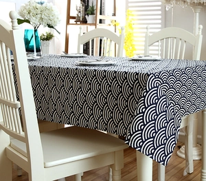 Detail of navy blue wave pattern tablecloth with white lace edges in Japanese zakka style